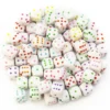 Бусины пластиковые Кости игральные 8х8 мм +-25 г 50 шт. Белые с разными цветами